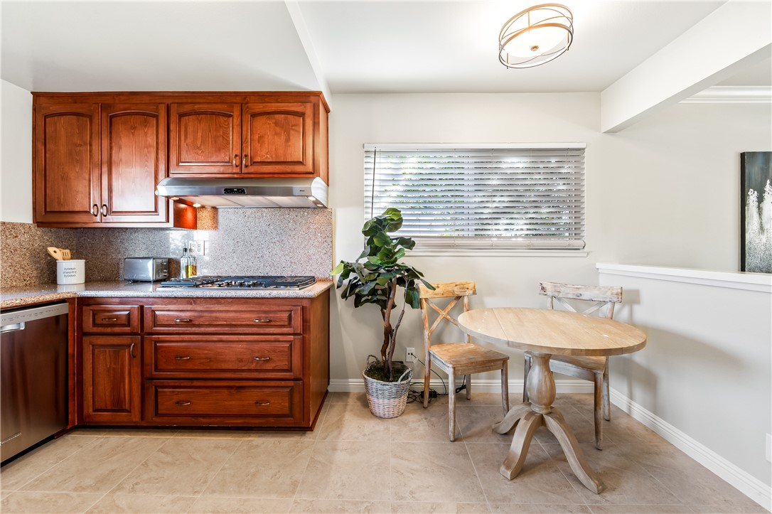 10191 Virgil Circle Cypress, CA 90630 - Photo 16 of 53 a kitchen with a sink and cabinets