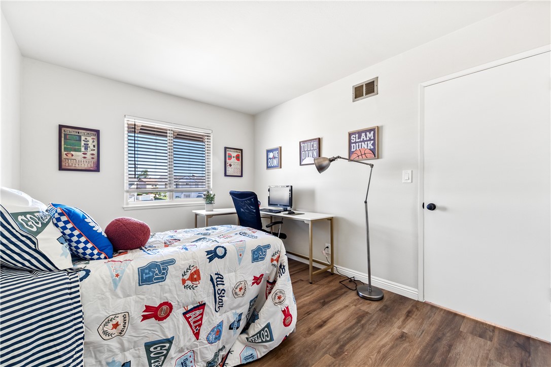 10191 Virgil Circle Cypress, CA 90630 - Photo 22 of 53 a bedroom with a bed and a window