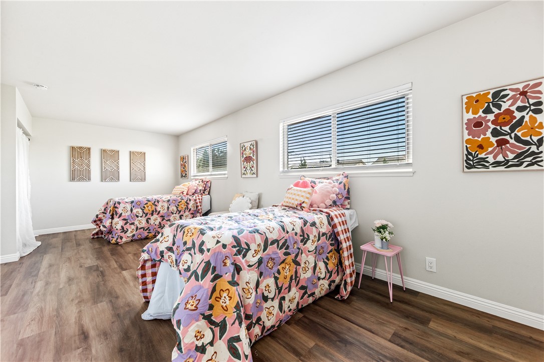 10191 Virgil Circle Cypress, CA 90630 - Photo 26 of 53 a bed room with two beds and a couch