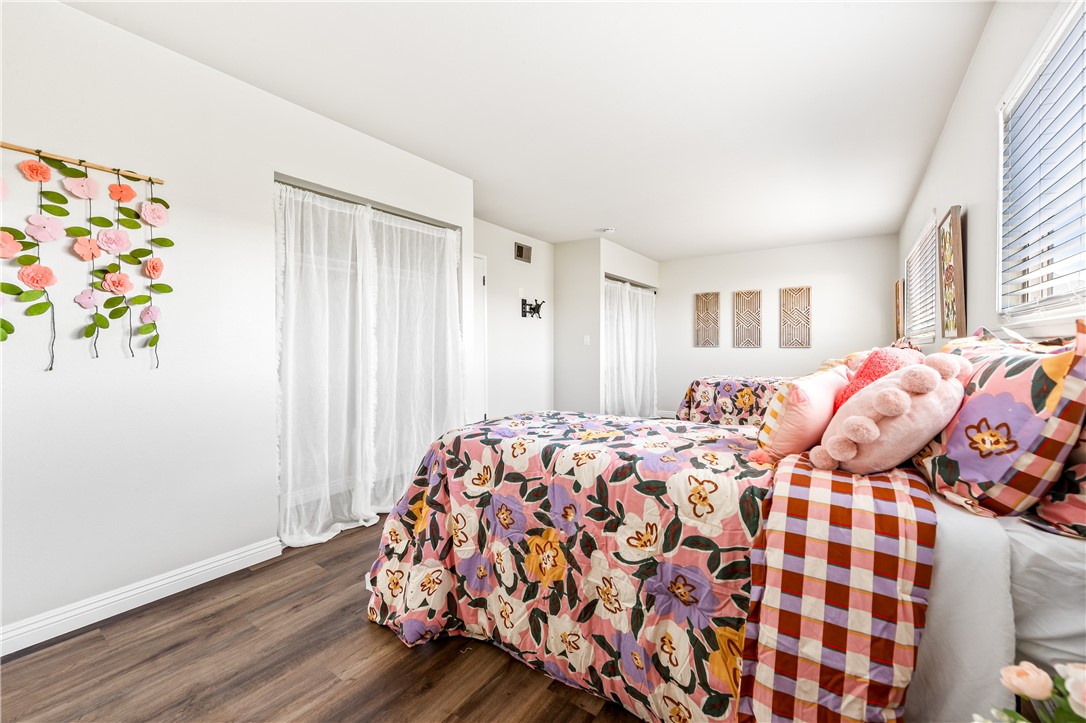 10191 Virgil Circle Cypress, CA 90630 - Photo 27 of 53 a bedroom with a bed and a window