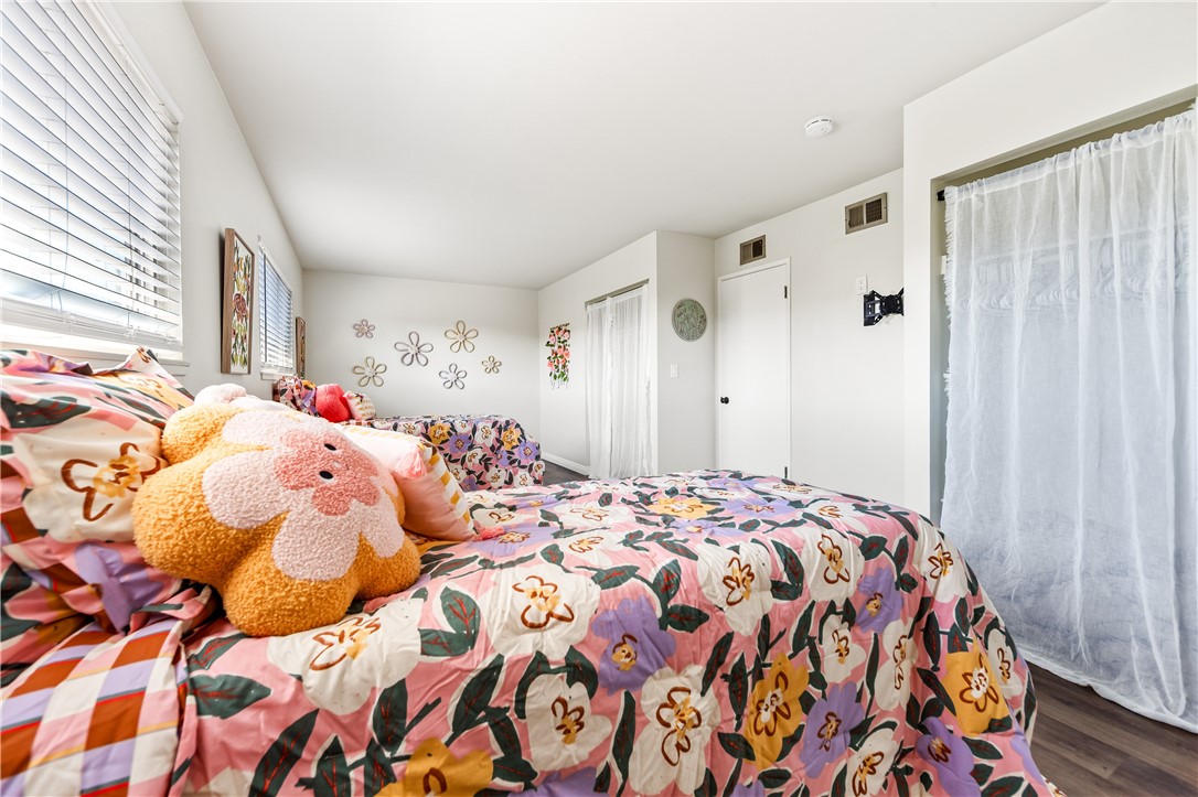 10191 Virgil Circle Cypress, CA 90630 - Photo 28 of 53 a bedroom with a bed and a window