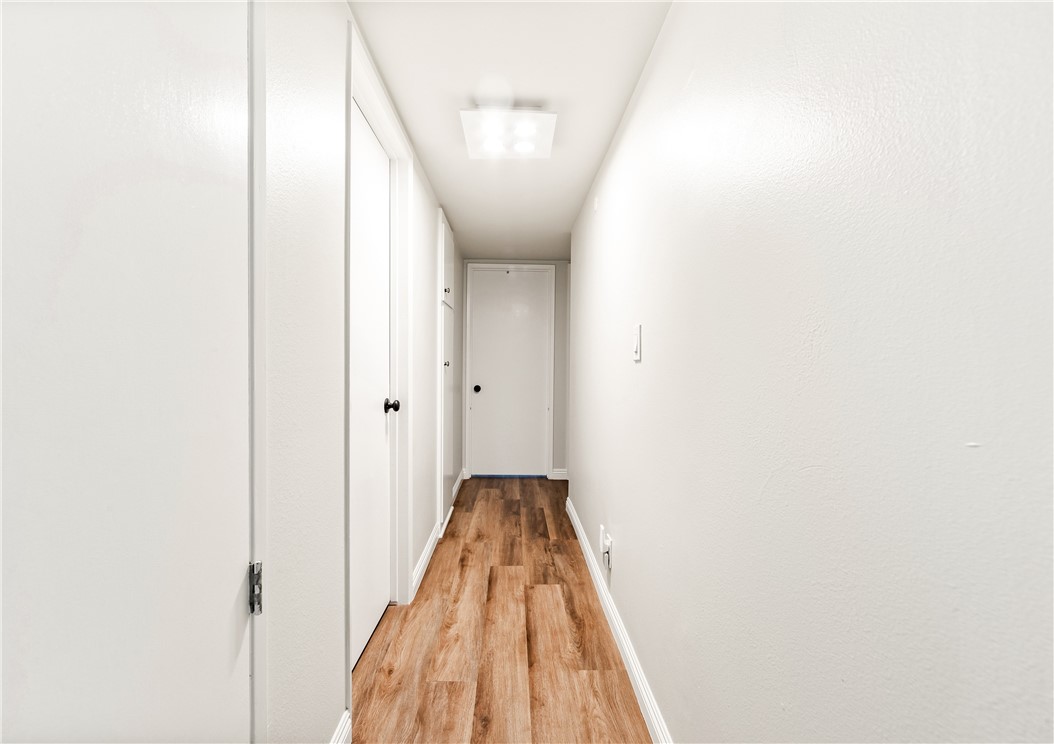 10191 Virgil Circle Cypress, CA 90630 - Photo 29 of 53 a view of a hallway with a white walls