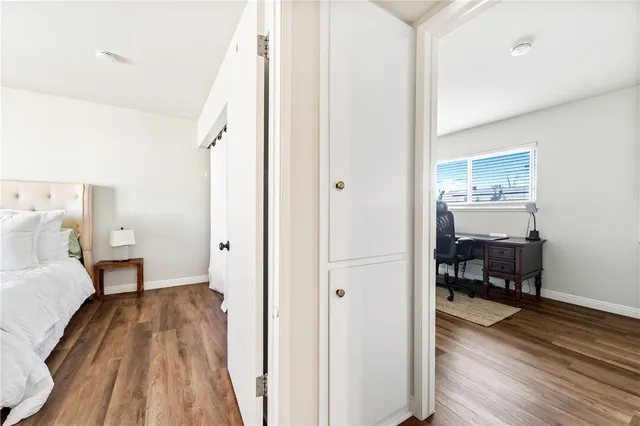 a workspace room with furniture and wooden floor