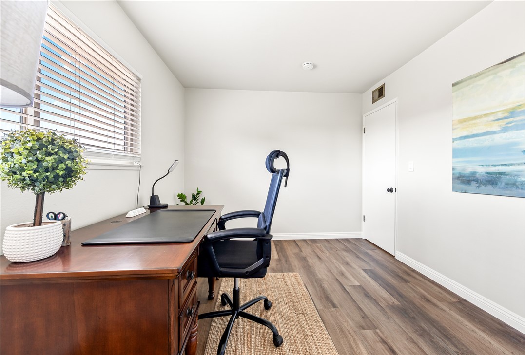 10191 Virgil Circle Cypress, CA 90630 - Photo 36 of 53 a view of a workspace with furniture and a potted plant