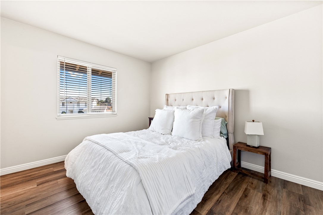 10191 Virgil Circle Cypress, CA 90630 - Photo 37 of 53 a large bed sitting in a bedroom next to a window