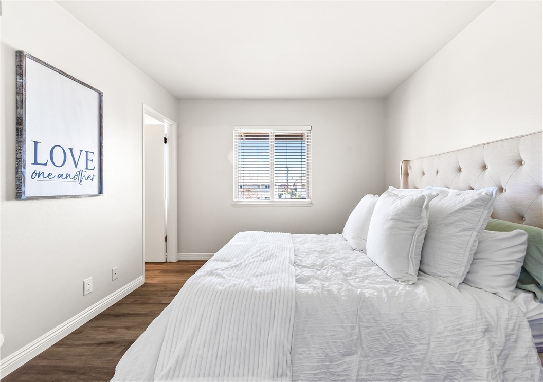 10191 Virgil Circle Cypress, CA 90630 - Photo 38 of 53 a bedroom with a large bed and a window