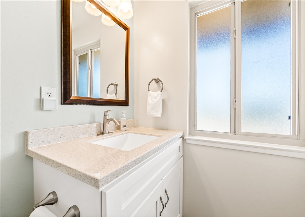 10191 Virgil Circle Cypress, CA 90630 - Photo 42 of 53 a bathroom with a sink and a mirror