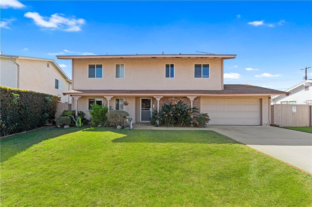 10191 Virgil Circle Cypress, CA 90630 - Photo 51 of 53 a front view of house with yard and green space