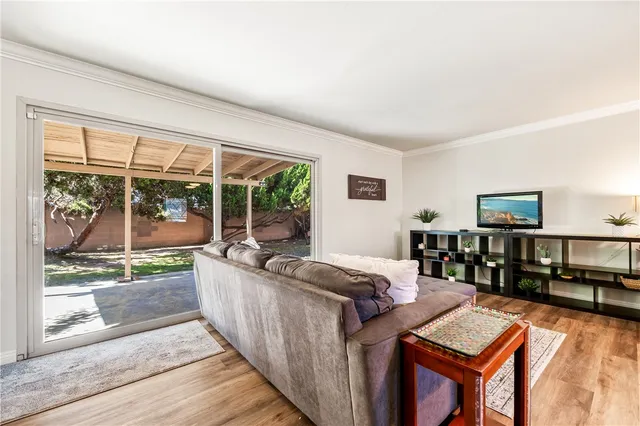 a view of a livingroom with furniture and a potted plant