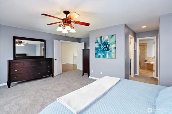 a bedroom with a bed and a dresser