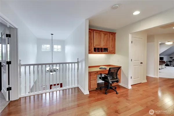 a view of a hallway with seating area