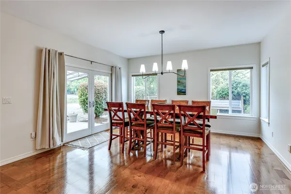 a dining room with furniture window wooden floor