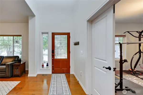 a view of a bedroom with gym equipment