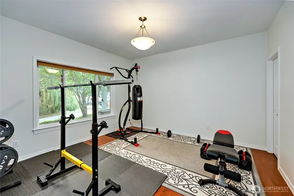 a room with gym equipment and a window