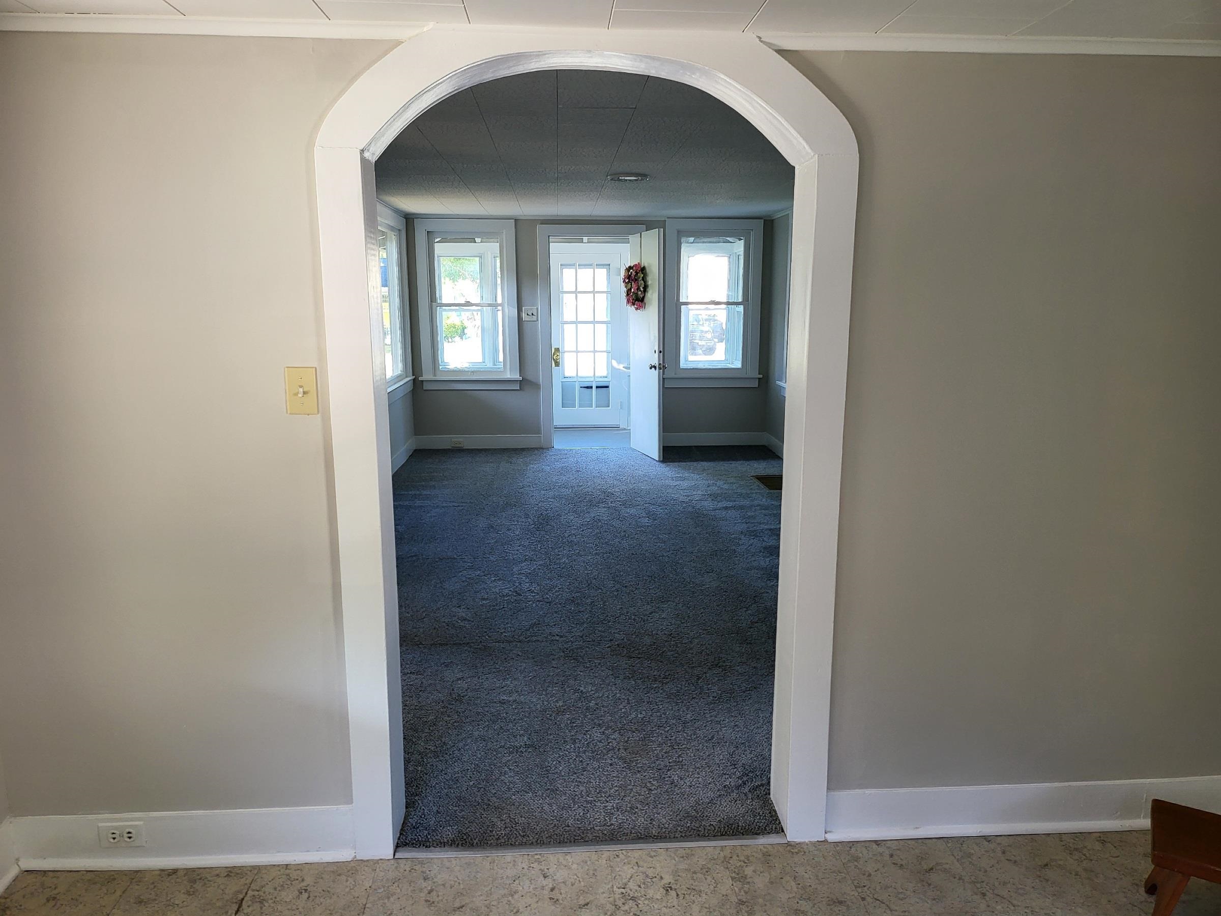 611 Breakwater Road Erma, NJ 08204 - Photo 11 of 12 a view of a hallway with wooden floor and a living room