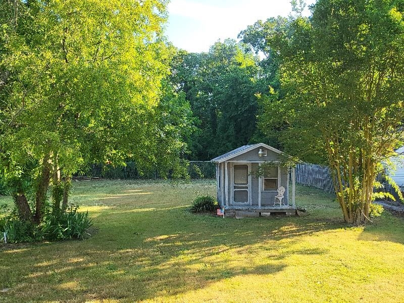 611 Breakwater Road Erma, NJ 08204 - Photo 4 of 12 a front view of a house with swimming pool and trees