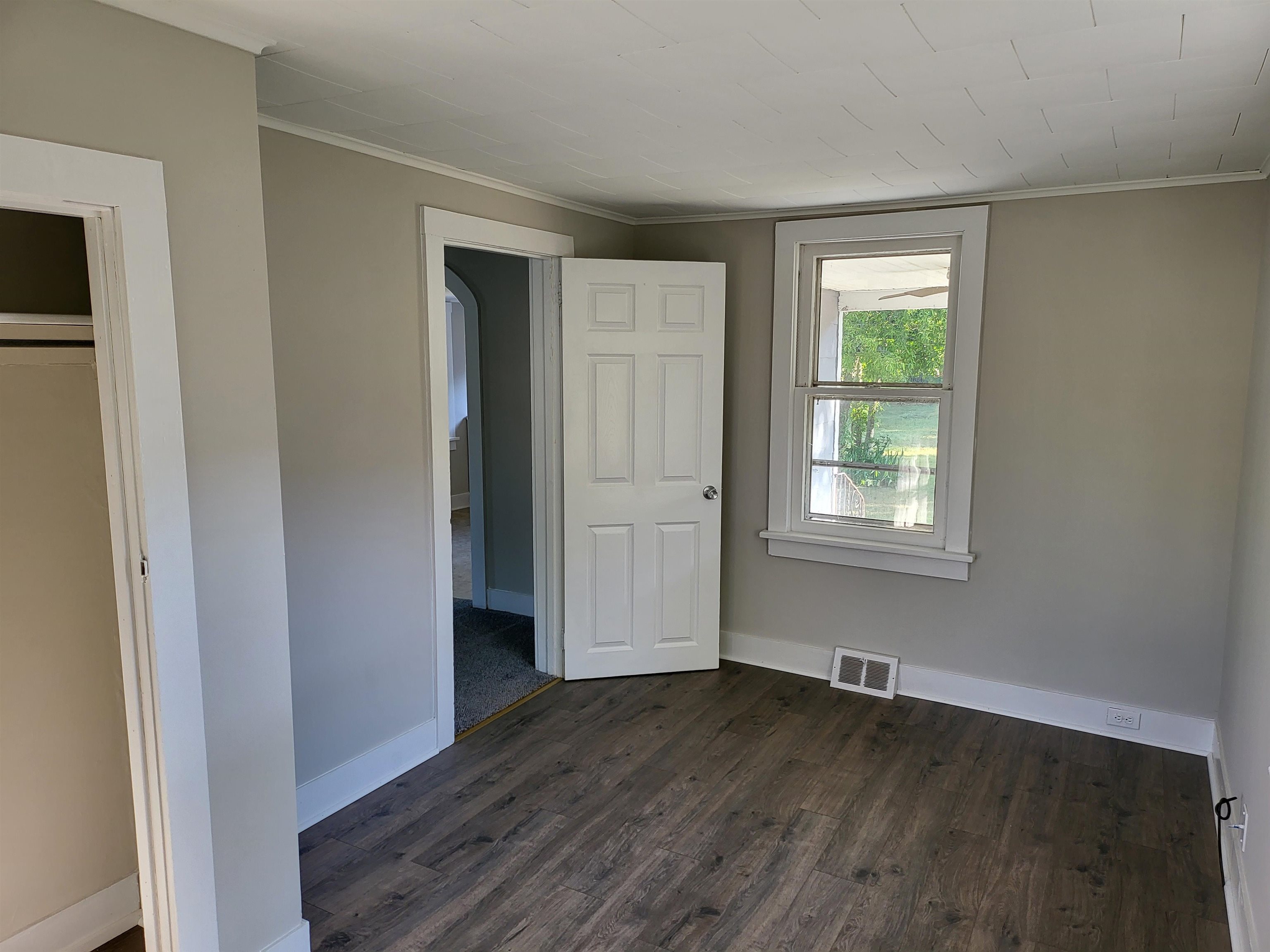 611 Breakwater Road Erma, NJ 08204 - Photo 6 of 12 an empty room with wooden floor and windows