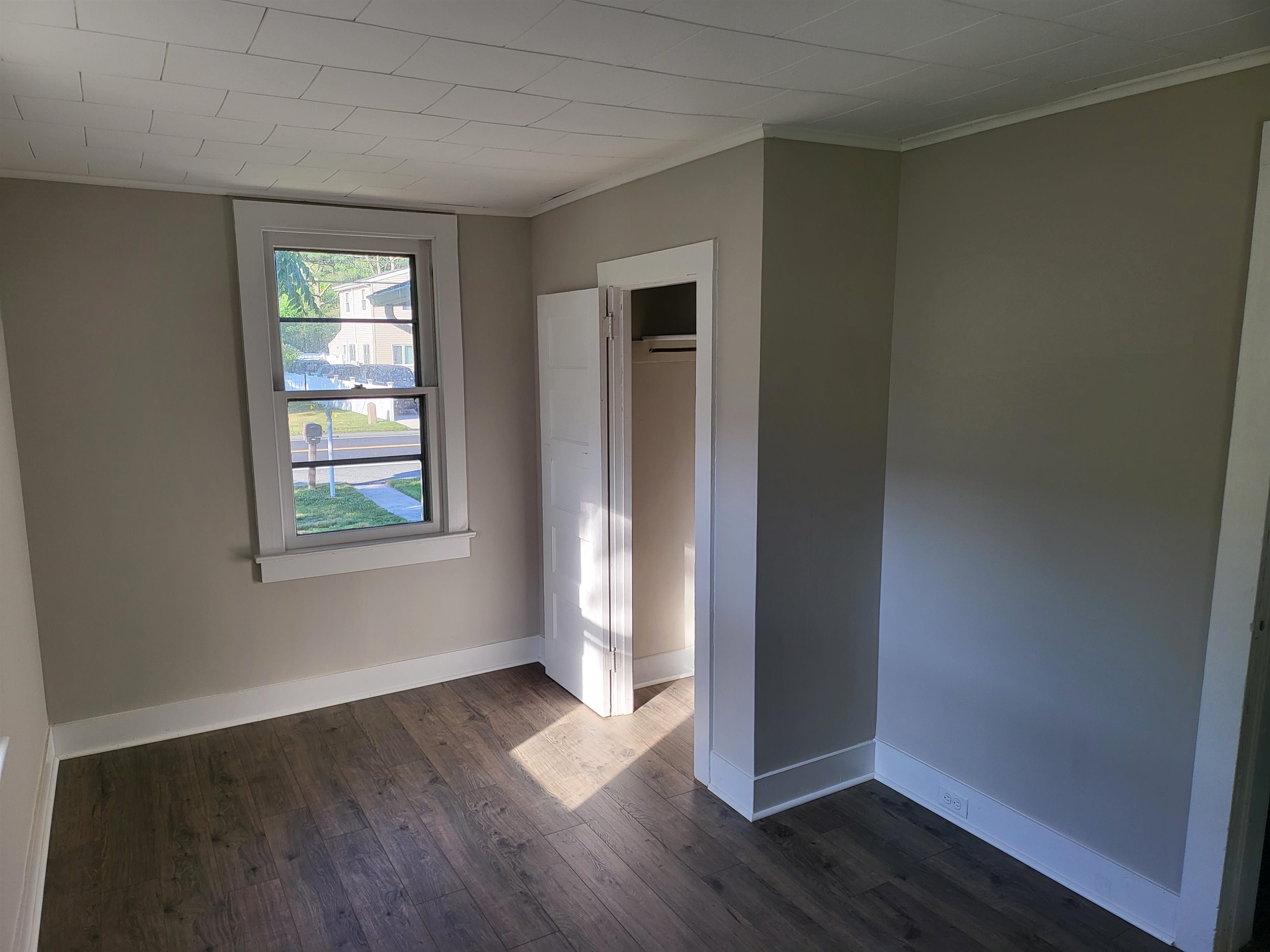 611 Breakwater Road Erma, NJ 08204 - Photo 7 of 12 an empty room with wooden floor and windows