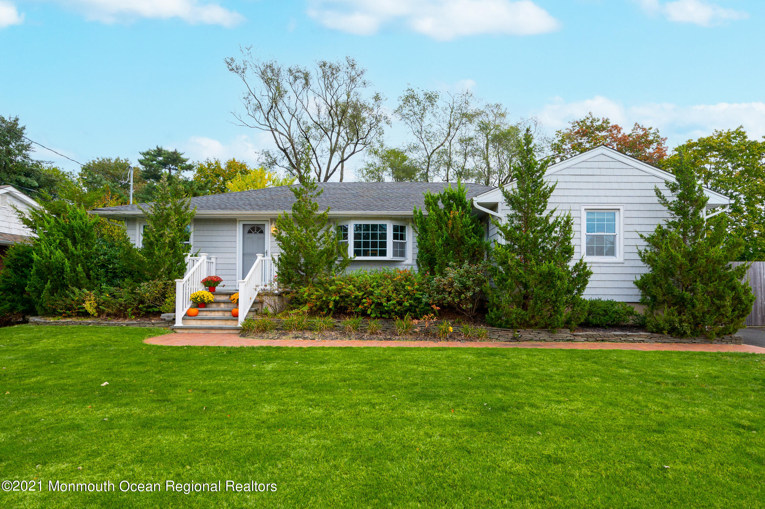 314 Sudbury Road Point Pleasant, NJ 08742 - Photo 1 of 21 a front view of a house with garden and porch