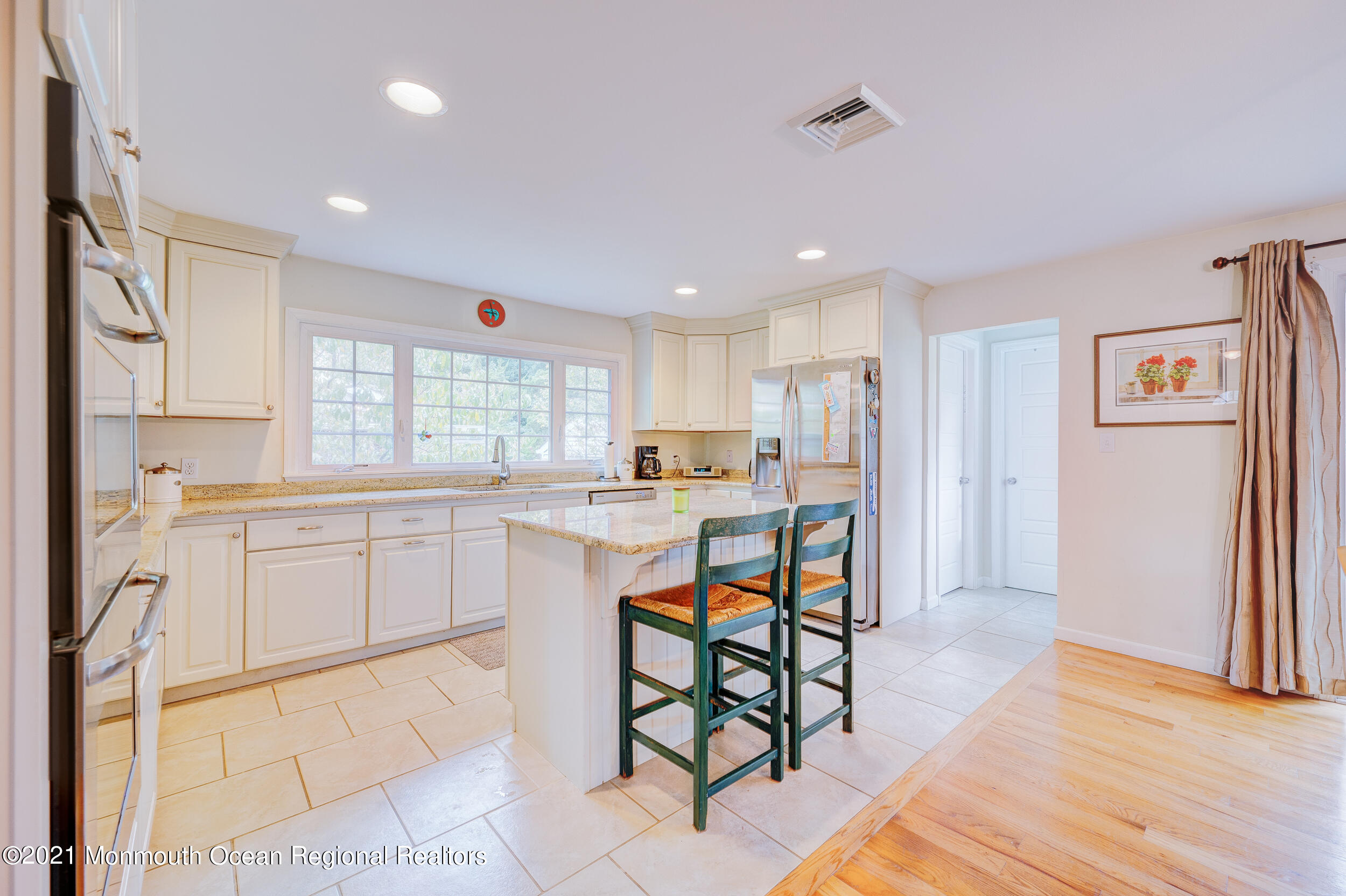 314 Sudbury Road Point Pleasant, NJ 08742 - Photo 11 of 21 a kitchen with white cabinets and refrigerator