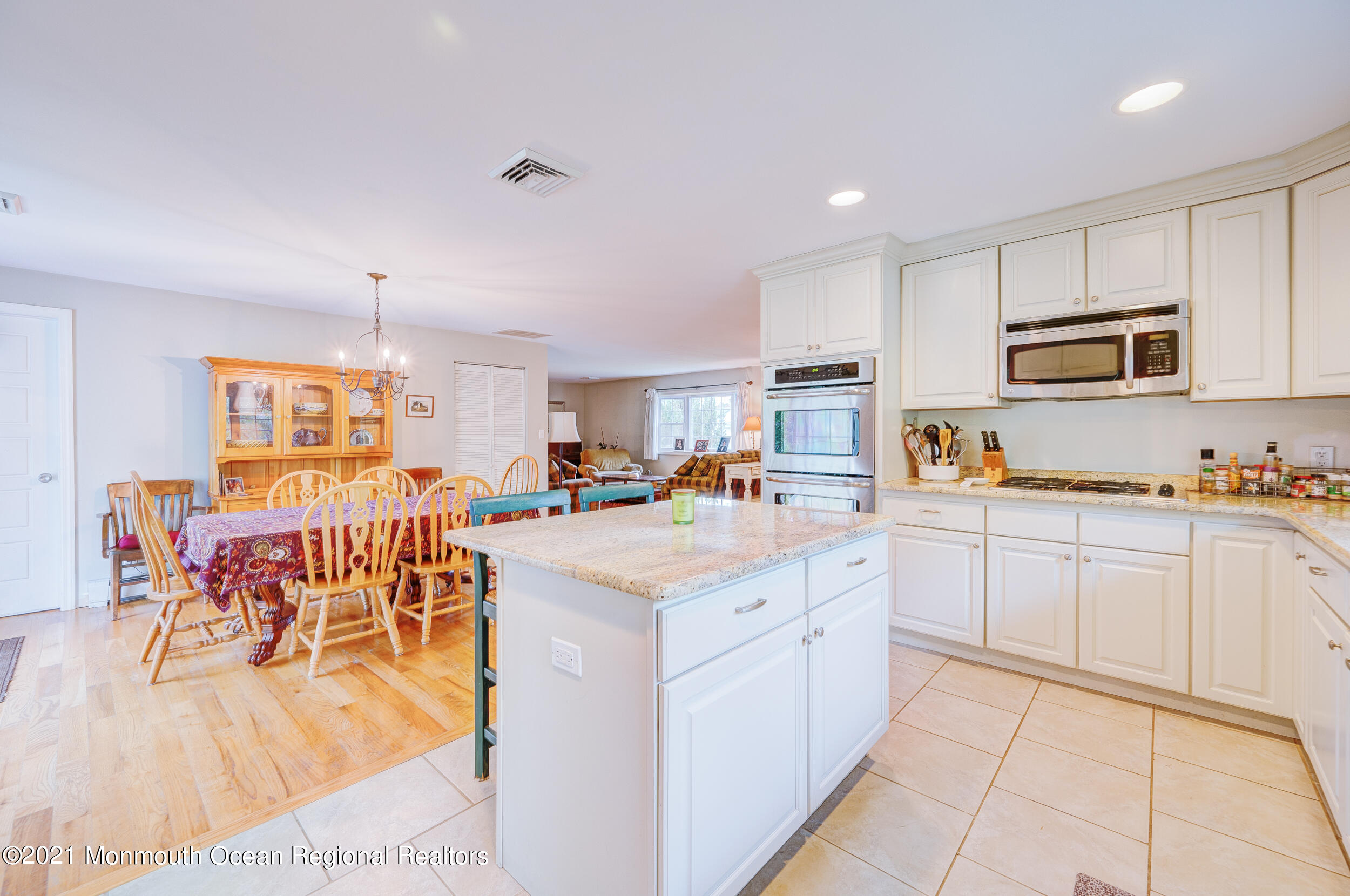 314 Sudbury Road Point Pleasant, NJ 08742 - Photo 13 of 21 a open kitchen with stainless steel appliances granite countertop a refrigerator and a stove top oven