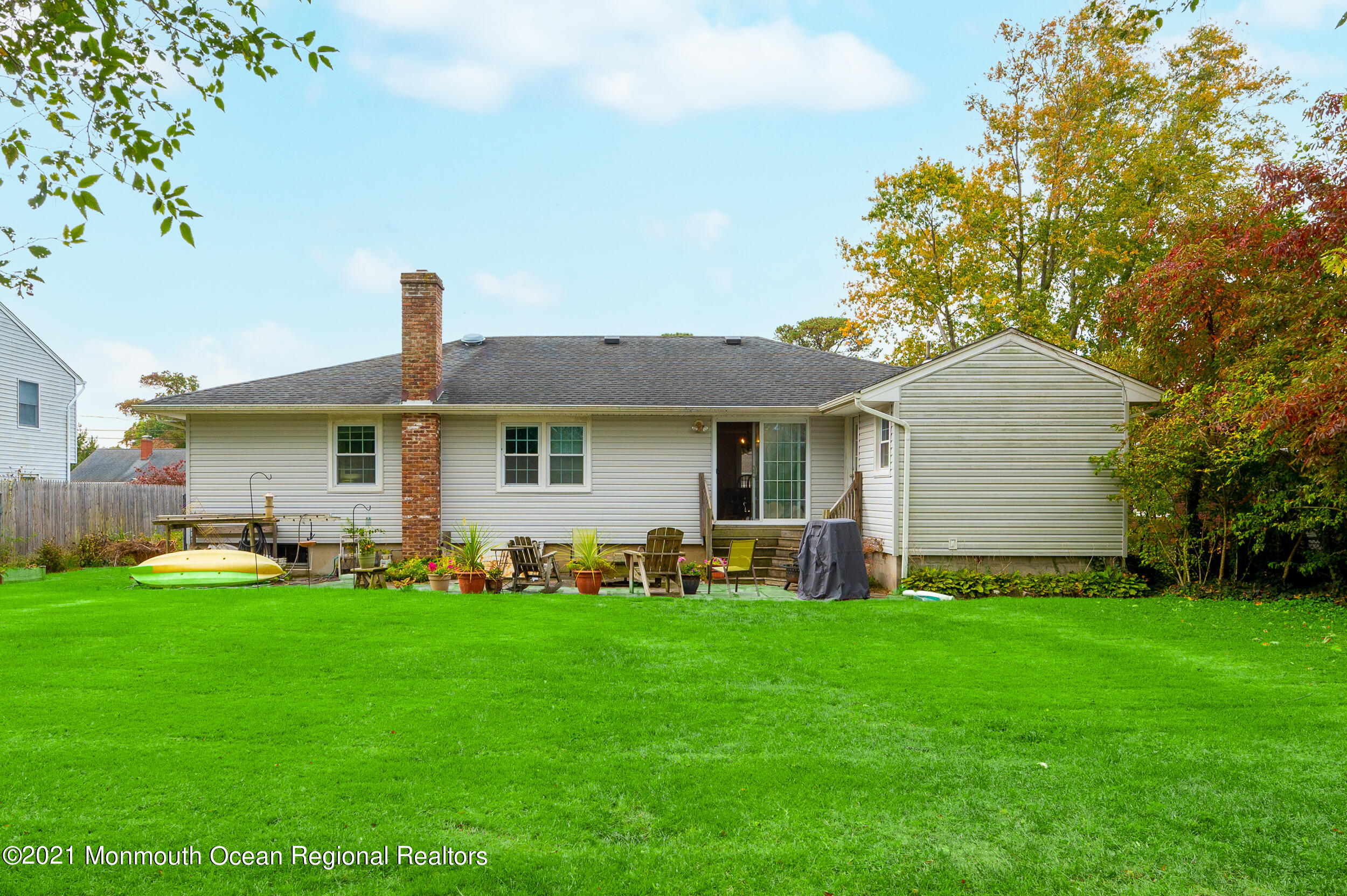 314 Sudbury Road Point Pleasant, NJ 08742 - Photo 21 of 21 a front view of a house with a garden and yard