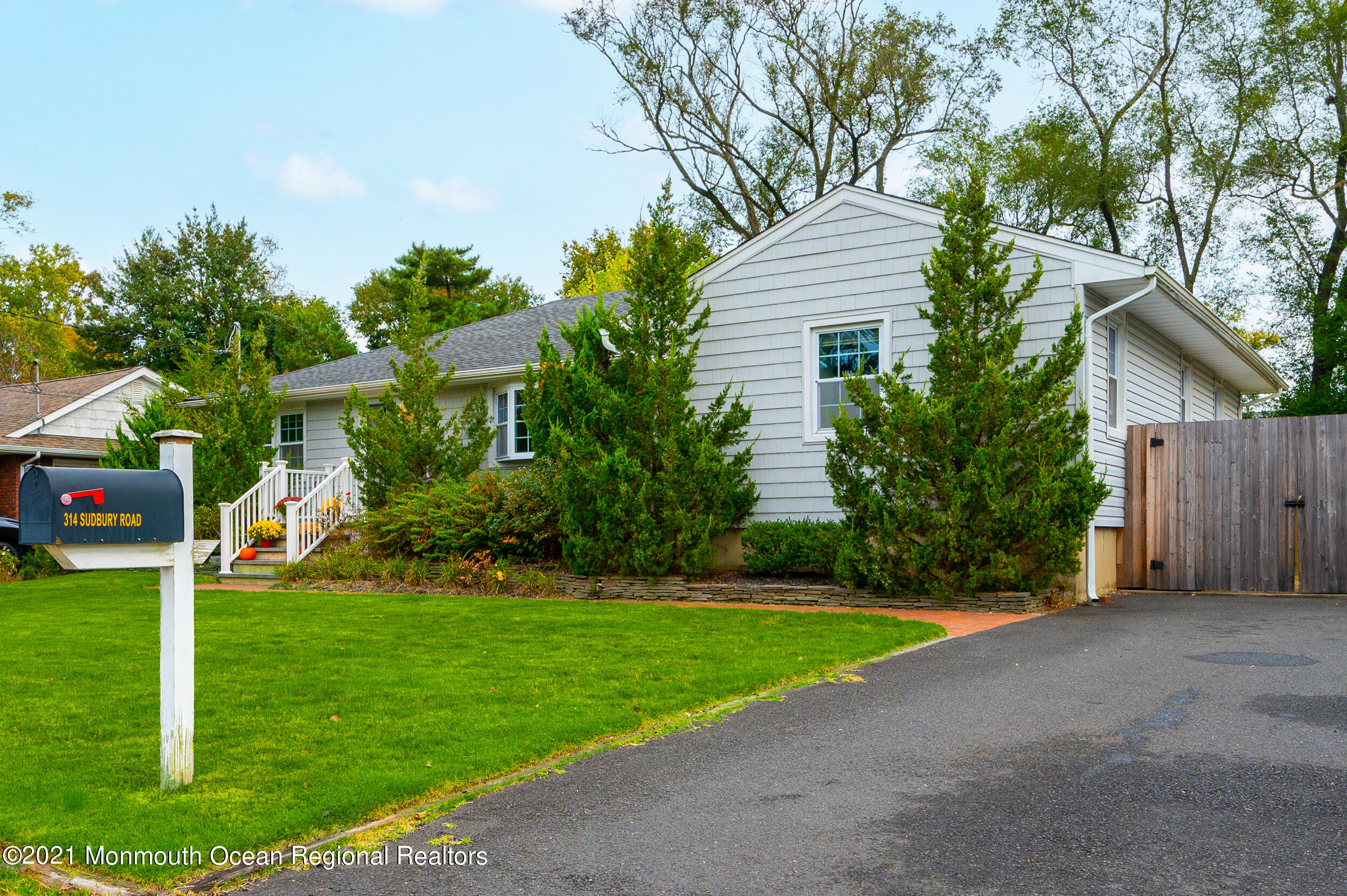 314 Sudbury Road Point Pleasant, NJ 08742 - Photo 4 of 21 a view of a house with a yard and tree s
