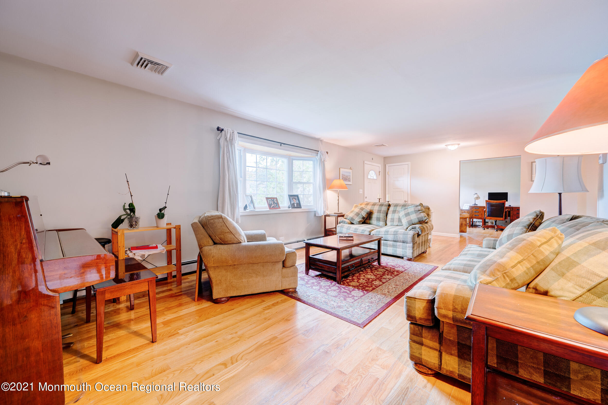 314 Sudbury Road Point Pleasant, NJ 08742 - Photo 7 of 21 a living room with furniture and a large window