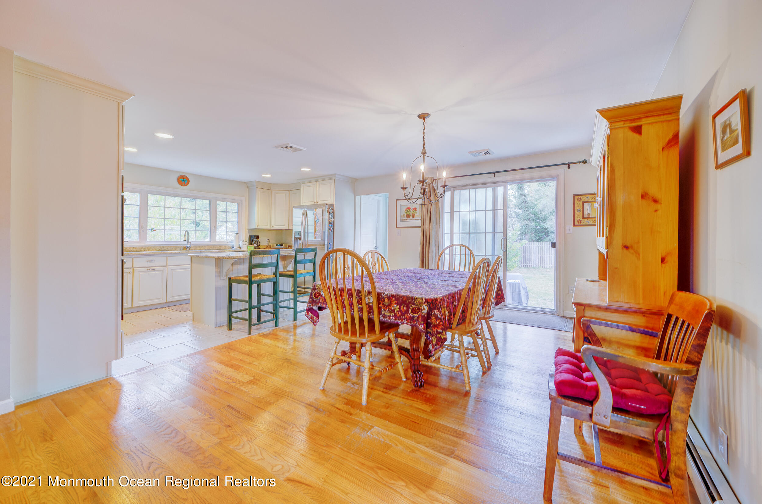 314 Sudbury Road Point Pleasant, NJ 08742 - Photo 9 of 21 a view of a dining room with furniture window and wooden floor