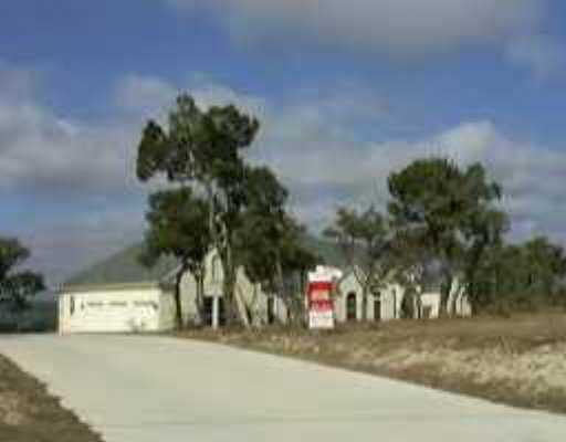a view of a street with a building in the background