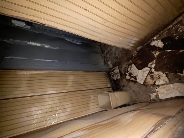 a bathroom with a sink and glass door