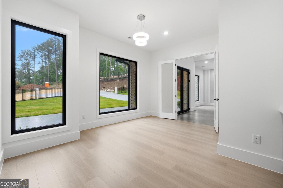 1563 Whitley Road Bethlehem, GA 30620 - Photo 27 of 44 an empty room with windows and entrance