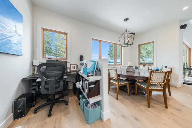 a view of a dining room with furniture window and outside view