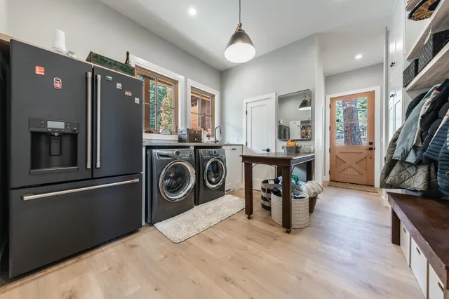 a kitchen with stainless steel appliances granite countertop a refrigerator and a stove top oven