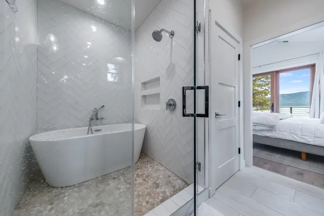 a spacious bathroom with a tub and shower