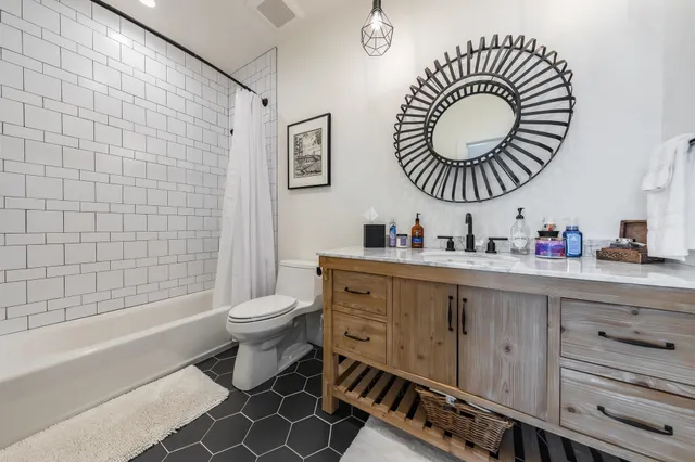 a bathroom with a sink a toilet and a bathtub