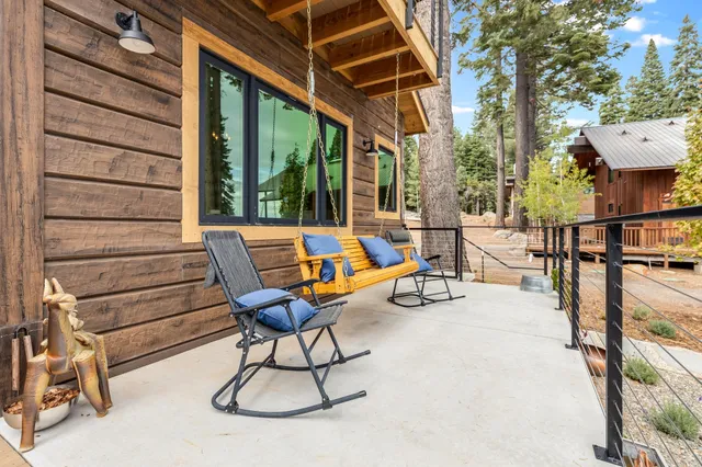 a view of a patio with a table and chairs