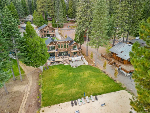 an aerial view of a house with a garden and trees