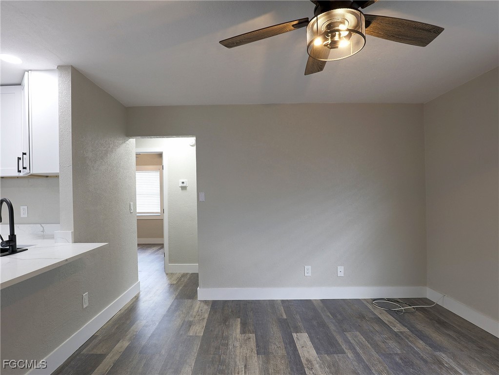 14181 Old Olga Road Fort Myers, FL 33905 - Photo 3 of 13 a view of empty room with wooden floor