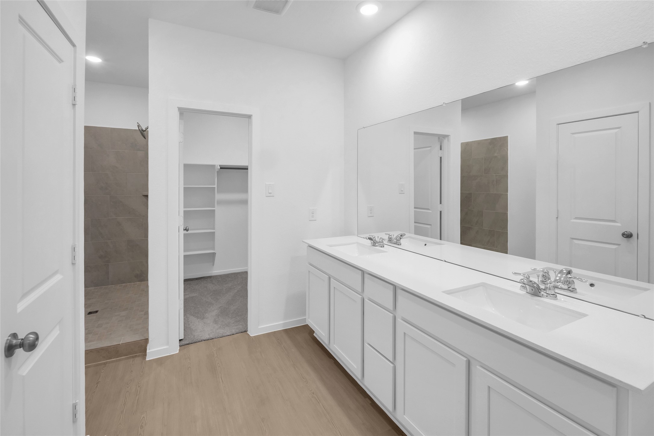 5437 Bear Run Bryan, TX 77807 - Photo 19 of 35 a bathroom with a double vanity sink and a mirror