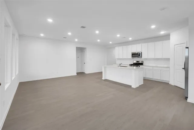 a bathroom with a toilet and a bath tub
