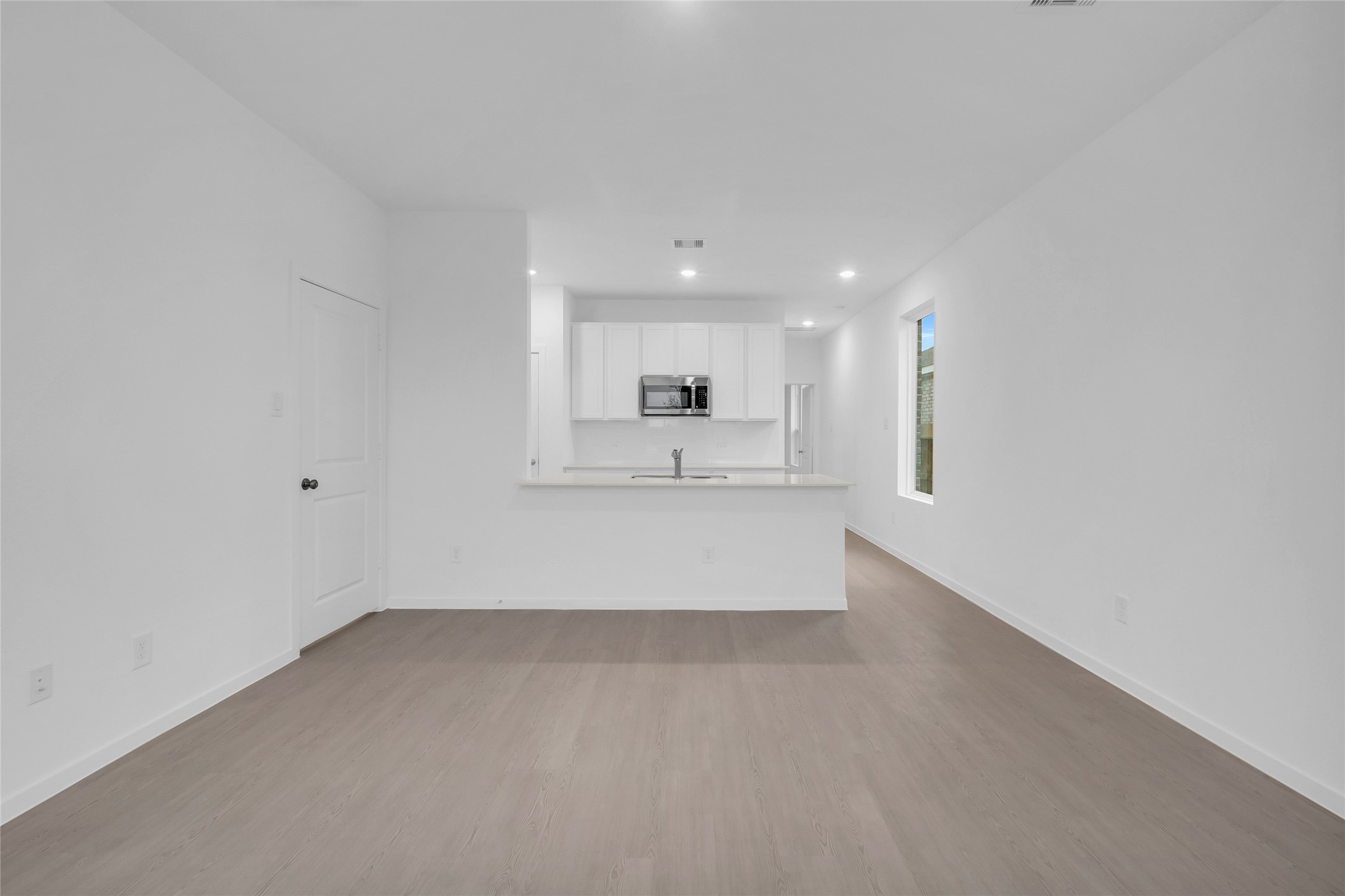 5437 Bear Run Bryan, TX 77807 - Photo 11 of 35 a view of kitchen with kitchen island a sink wooden floor and a refrigerator in it