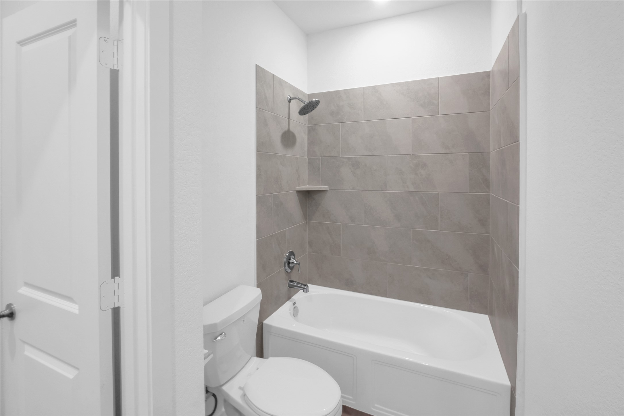 5437 Bear Run Bryan, TX 77807 - Photo 16 of 35 a bathroom with a toilet and a bath tub