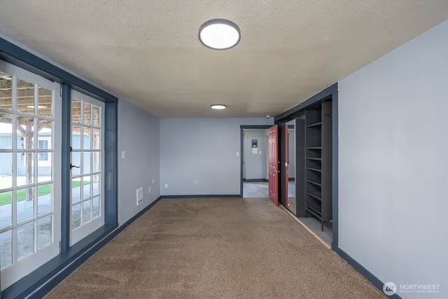 an empty room with windows