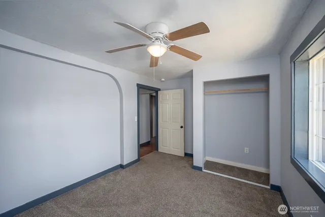 a view of an empty room with a window