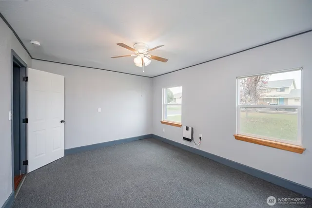 a view of an empty room with a window