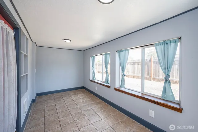 a view of an empty room with a window