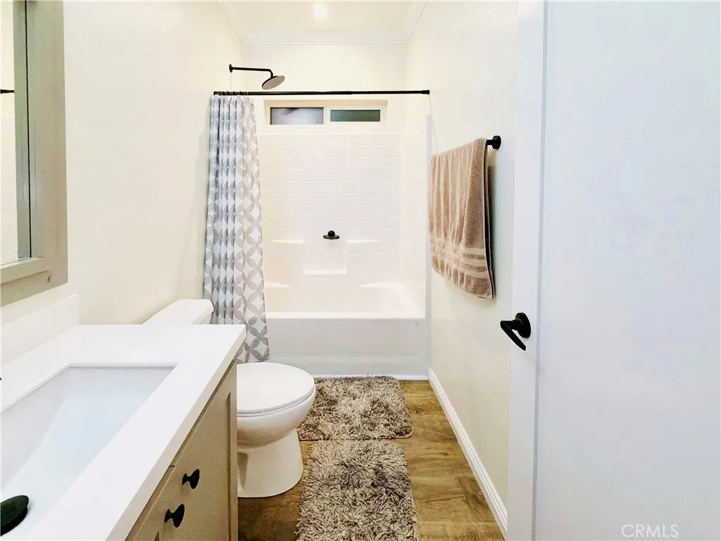 12530 Royal, Unit 46 El Cajon, CA 92021 - Photo 10 of 17 a bathroom with a sink a toilet a window and shower