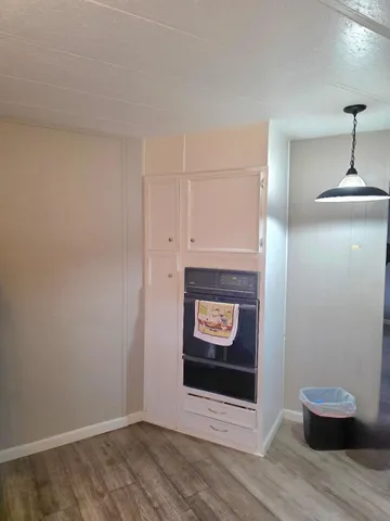 a bedroom with a bed a desk and chair