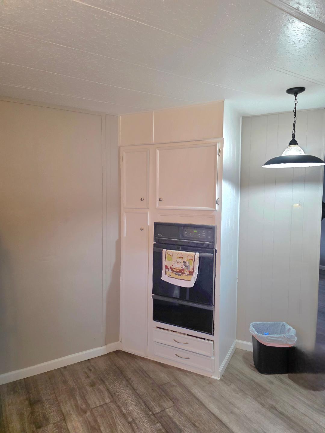 264 Mercury Circle Gustine, CA 95322 - Photo 8 of 18 a view of an empty room and wooden floor